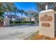 Entrance to a gated community with lush landscaping and a private no soliciting sign at 801 Montrose Dr # 202, Venice, FL 34293