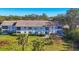 Charming condo building with lush landscaping, offering a serene and inviting curb appeal at 801 Montrose Dr # 202, Venice, FL 34293