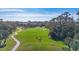 Scenic golf course view featuring lush greenery and players at 801 Montrose Dr # 202, Venice, FL 34293