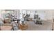 Bright living room with comfortable seating, glass table, and serene view from the attached porch at 801 Montrose Dr # 202, Venice, FL 34293
