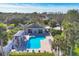 Aerial view of pool featuring an extended lounge area and lush tropical landscaping at 801 Montrose Dr # 202, Venice, FL 34293