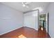 This bedroom features wood floors, a ceiling fan and a closet for lots of storage at 820 Placid Lake Dr, Osprey, FL 34229