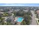 Aerial view of the community pool, featuring lounge chairs, clubhouse and ample space for residents at 820 Placid Lake Dr, Osprey, FL 34229