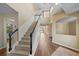 Bright foyer with a staircase, hardwood floors, high ceilings, and an open floor plan at 820 Placid Lake Dr, Osprey, FL 34229