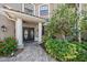Charming front entrance with a beautiful double-door, decorative plants, and a tiled walkway at 820 Placid Lake Dr, Osprey, FL 34229