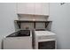 Laundry room featuring a modern washer and dryer, shelf and cabinets at 820 Placid Lake Dr, Osprey, FL 34229