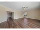 Bright and airy living room with hardwood floors and staircase access at 820 Placid Lake Dr, Osprey, FL 34229