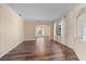 Inviting living room with hardwood floors, soft lighting, and decorative archways at 820 Placid Lake Dr, Osprey, FL 34229