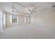 This expansive main bedroom is well-lit by natural light from the windows and has a fan at 820 Placid Lake Dr, Osprey, FL 34229