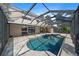 Back exterior with a beautiful pool overlooking a large lake at 820 Placid Lake Dr, Osprey, FL 34229