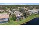 Aerial view of a home with screened in pool overlooking the water, perfect for outdoor living at 820 Placid Lake Dr, Osprey, FL 34229