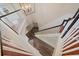 Staircase featuring hardwood steps, white risers, and a black and white banister at 820 Placid Lake Dr, Osprey, FL 34229