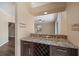 Interior wet bar features granite countertops, wooden wine rack, and tiled backsplash at 820 Placid Lake Dr, Osprey, FL 34229