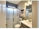 Modern bathroom featuring a glass-enclosed shower, gray tones, and a sleek design at 9013 Kingsbury Pl, Bradenton, FL 34212