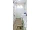 Clean bathroom features a vanity, toilet, window, and shower with butterfly curtain at 10315 Cortez W Rd # 28-1, Bradenton, FL 34210