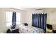 Cozy bedroom features a twin bed, window, and efficient wall-mounted air conditioning unit at 10315 Cortez W Rd # 28-1, Bradenton, FL 34210