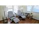 Comfortable living area featuring two recliners, side tables and lamps, hardwood floors and a relaxing atmosphere at 10315 Cortez W Rd # 28-1, Bradenton, FL 34210