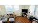 Comfortable living area featuring hardwood floors, a TV, ample seating, and a relaxing atmosphere at 10315 Cortez W Rd # 28-1, Bradenton, FL 34210