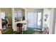 Comfortable living room with sliding glass door access to the outdoor area at 10315 Cortez W Rd # 28-1, Bradenton, FL 34210