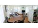 Inviting living area featuring a dining table, comfortable seating, and ample natural light at 10315 Cortez W Rd # 28-1, Bradenton, FL 34210