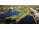 Stunning aerial view of a golf course with ponds and lush landscaping at 10406 Eastwood Dr, Bradenton, FL 34211