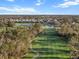 Scenic aerial view of the golf course with lush green fairways winding through mature trees at 10406 Eastwood Dr, Bradenton, FL 34211