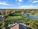 Expansive aerial view showcasing the golf course, pond, and lush surroundings, providing a serene backdrop at 10406 Eastwood Dr, Bradenton, FL 34211