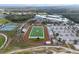 Aerial of athletic complex featuring a track, football field, baseball diamond, and tennis courts at 10406 Eastwood Dr, Bradenton, FL 34211