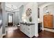 Inviting foyer with wood floors, detailed trim, and attractive entry table at 10406 Eastwood Dr, Bradenton, FL 34211