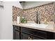A beautifully decorated kitchen with tile backsplash and modern sink fixtures at 10406 Eastwood Dr, Bradenton, FL 34211