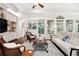 Elegant living room with hardwood floors, custom shelving, and stylish furnishings at 10406 Eastwood Dr, Bradenton, FL 34211