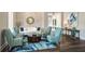 Comfortable living room with stone accent wall, stylish seating, and elegant decor at 10406 Eastwood Dr, Bradenton, FL 34211