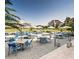 Relaxing outdoor patio with dining tables, chairs, and views of the golf course at 10406 Eastwood Dr, Bradenton, FL 34211