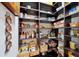 Walk-in pantry with abundant shelving for optimal storage at 10406 Eastwood Dr, Bradenton, FL 34211