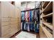 Organized walk-in closet featuring built-in shelving and ample drawer space at 10406 Eastwood Dr, Bradenton, FL 34211