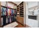 Custom walk-in closet with built-in shelving and storage solutions, connecting to ensuite bathroom at 10406 Eastwood Dr, Bradenton, FL 34211