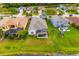 Backyard of property with a screened-in pool, a playground, and lush green grass, perfect for outdoor activities at 12211 Lavender Loop, Bradenton, FL 34212