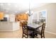Open dining space, next to the kitchen and featuring bright window to the back yard at 12211 Lavender Loop, Bradenton, FL 34212