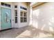 The entryway features a blue front door and windows, creating a bright and inviting entrance to the home at 12211 Lavender Loop, Bradenton, FL 34212