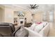 A bright and inviting living room offers a cozy fireplace and comfortable seating for relaxing and entertaining at 12211 Lavender Loop, Bradenton, FL 34212