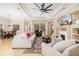 Bright, open living room features a fireplace, comfortable sofas, and stylish decor, creating a welcoming atmosphere at 12211 Lavender Loop, Bradenton, FL 34212