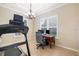 Office space featuring a treadmill, desk, and windows for natural lighting at 12211 Lavender Loop, Bradenton, FL 34212