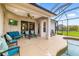 Covered patio with a pool, seating area, and screened enclosure, perfect for outdoor enjoyment at 12211 Lavender Loop, Bradenton, FL 34212
