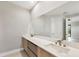 Bathroom featuring a double vanity with modern fixtures and countertop at 12495 Patsy Ave, Port Charlotte, FL 33981