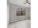 Bright and airy bedroom with large window overlooking lush greenery at 12495 Patsy Ave, Port Charlotte, FL 33981