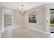 Dining Room featuring contemporary light fixture, and large windows with views of the outdoors at 12495 Patsy Ave, Port Charlotte, FL 33981