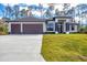Charming single Gathering home with a three-car garage and a spacious driveway at 12495 Patsy Ave, Port Charlotte, FL 33981