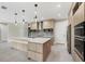 Modern kitchen with pendant lighting, ample counter space and sleek appliances at 12495 Patsy Ave, Port Charlotte, FL 33981