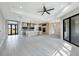 Spacious open-concept kitchen featuring sleek wood cabinets and an island sink at 12495 Patsy Ave, Port Charlotte, FL 33981