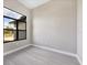 Bright room features natural light, a gray-toned floor and neutral walls at 12495 Patsy Ave, Port Charlotte, FL 33981